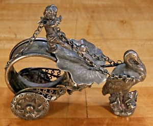 Antique Victorian Ornate Cherub And Stork Rolling Carriage Figural Napkin Ring