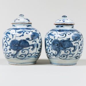 A Pair Of Chinese Blue And White Buddhist Lion Jars Ming Dynasty 16th Century