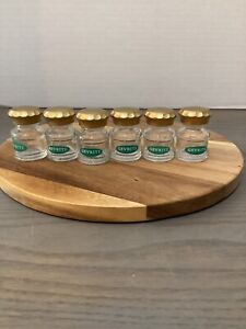 6 Glass Gevrite Apothecary Bottles With Gold Colored Lids