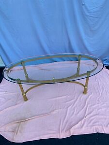 Late 20th Century Hollywood Regency Oval Glass And Brass Coffee Table
