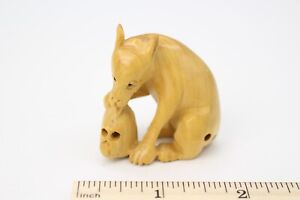 Netsuke Dog Biting Skull Japanese Carved Light Boxwood Signed