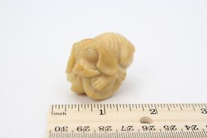 Okimono Dog Sitting On Fruit Japanese Carved Tagua Nut