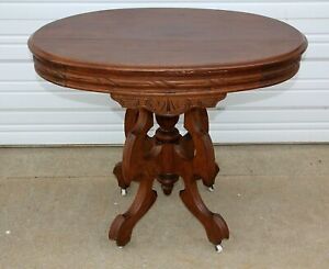 Antique Victorian Walnut Wood Oval Carved Parlor Table Finial Porcelain Casters