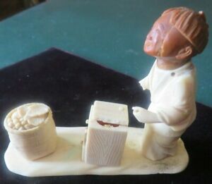 Chinese Or Japanese Figure Of Young Boy With Book And Basket Netsuke