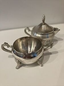 Silver Plated Creamer And Sugar Bowl W Legs Handles And A Lid That Fits Both 