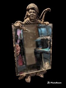 Vintage 1940s Art Deco Beveled Mirror With Bronze Frame Featuring A Man With Bow