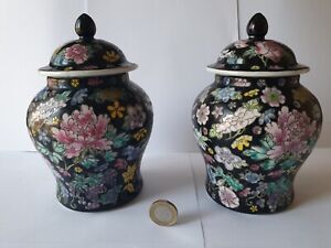 A Pair Of Chinese Famille Noire Vases And Covers In Mille Fleurs Pattern