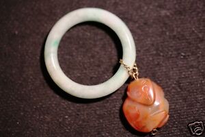 Estate Chinese Baby Bangle With One Suspending A Chalcedony Carving 20 Century