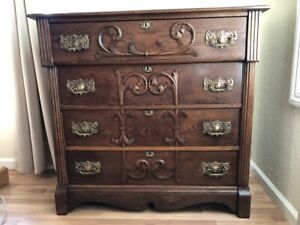 Eastlake Four Drawer Oak With Walnut Stain Dresser With Relief Brass Hardware