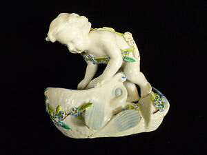 Hand Painted Soft Paste Porcelain Of A Child In Flowers W A Dolphin Circa 1820
